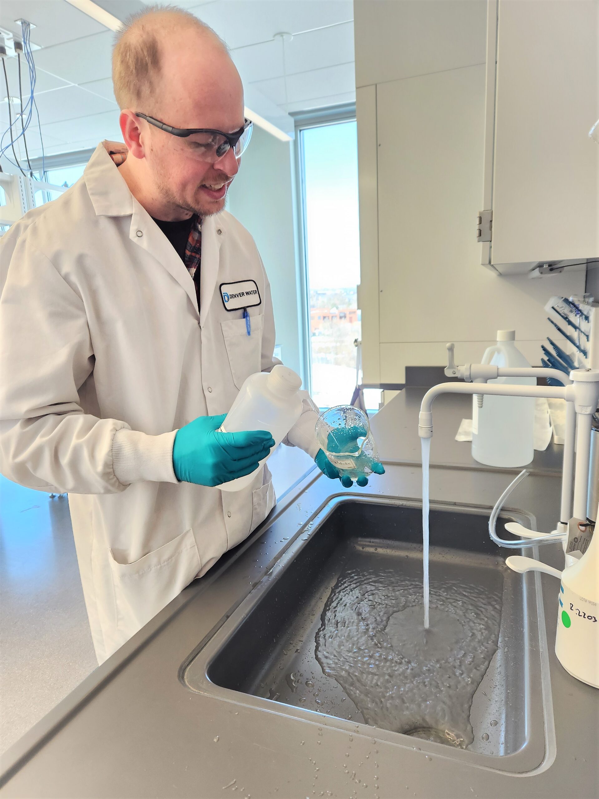 Denver Water's Michael Hendricks tests a water sample at the new water lab