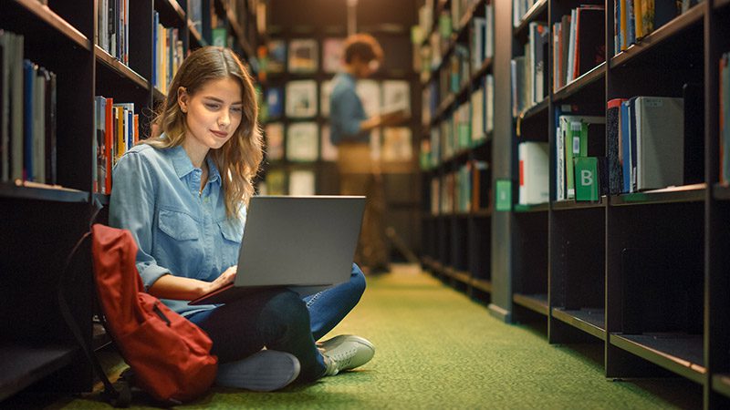 University,Library:,Gifted,Beautiful,Caucasian,Girl,Sitting,On,Floor,,Uses
